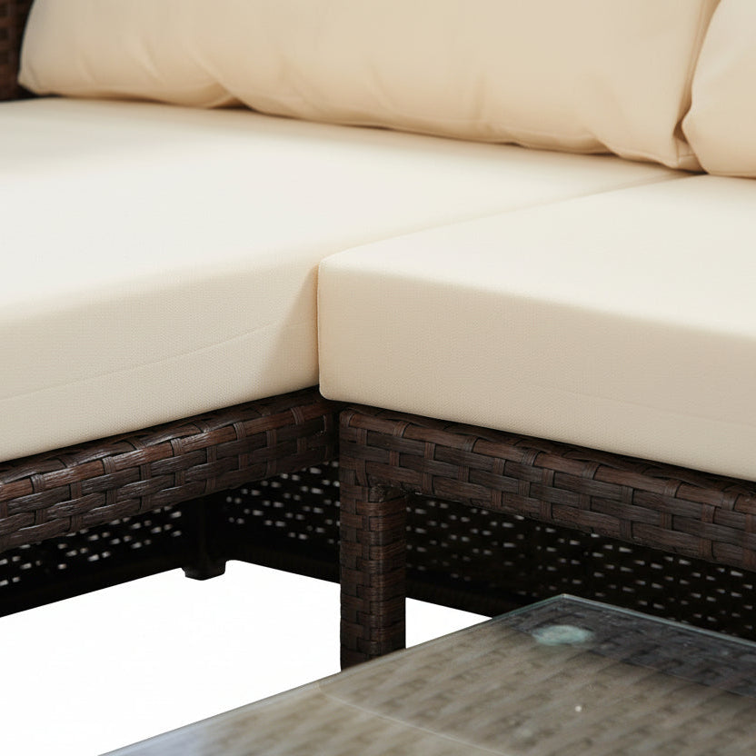 Left Hand Facing Outdoor Brown Rattan Corner Sofa with Coffee Table and Cream Cushions