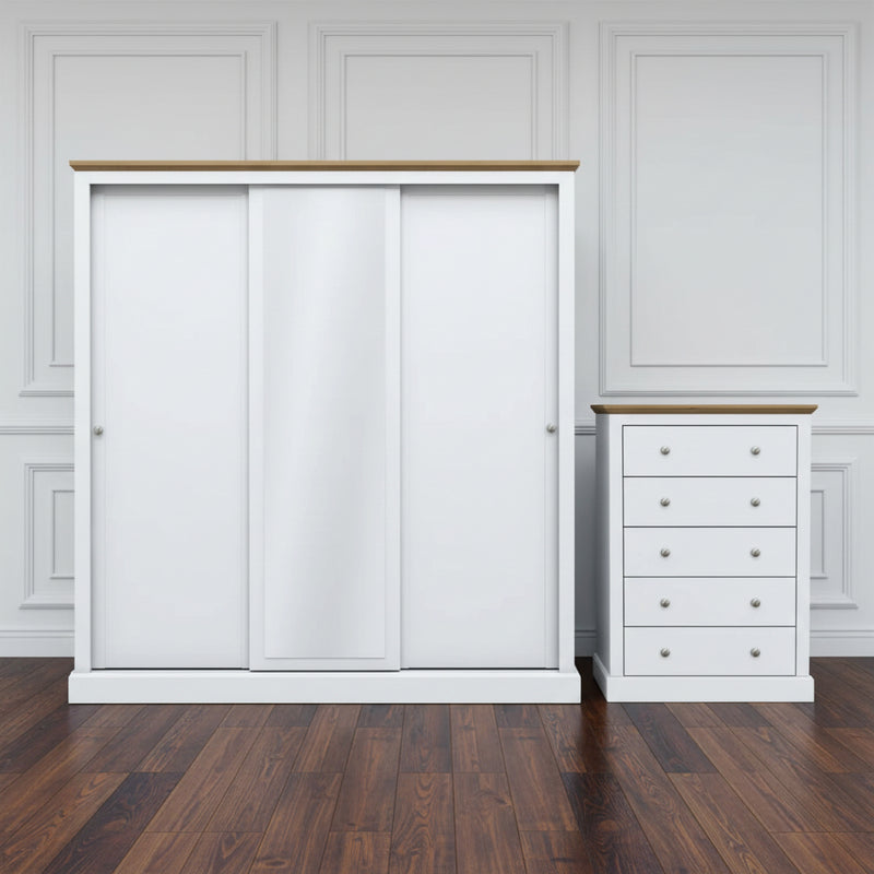 White wardrobe with sliding doors and a matching chest of drawers on a white background