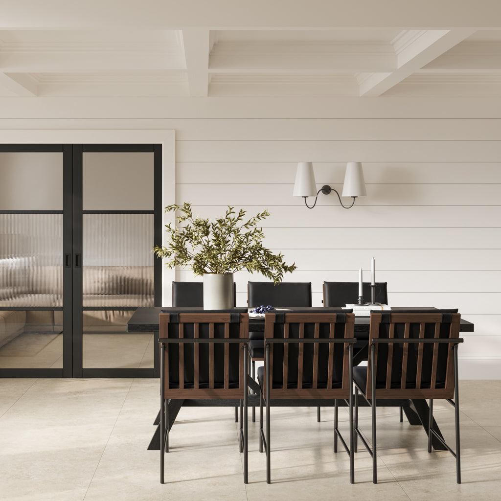 Harry Christian Home Jet Black Dining Chair With Stained Wooden Back and Base on top of a metal frame all sat around the harry christian large black dining table