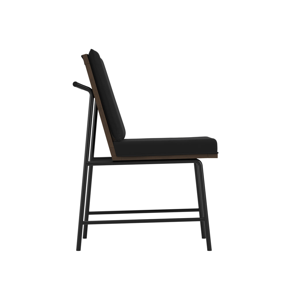 Harry Christian Home Jet Black Dining Chair With Stained Wooden Back and Base on top of a metal frame angled view side view