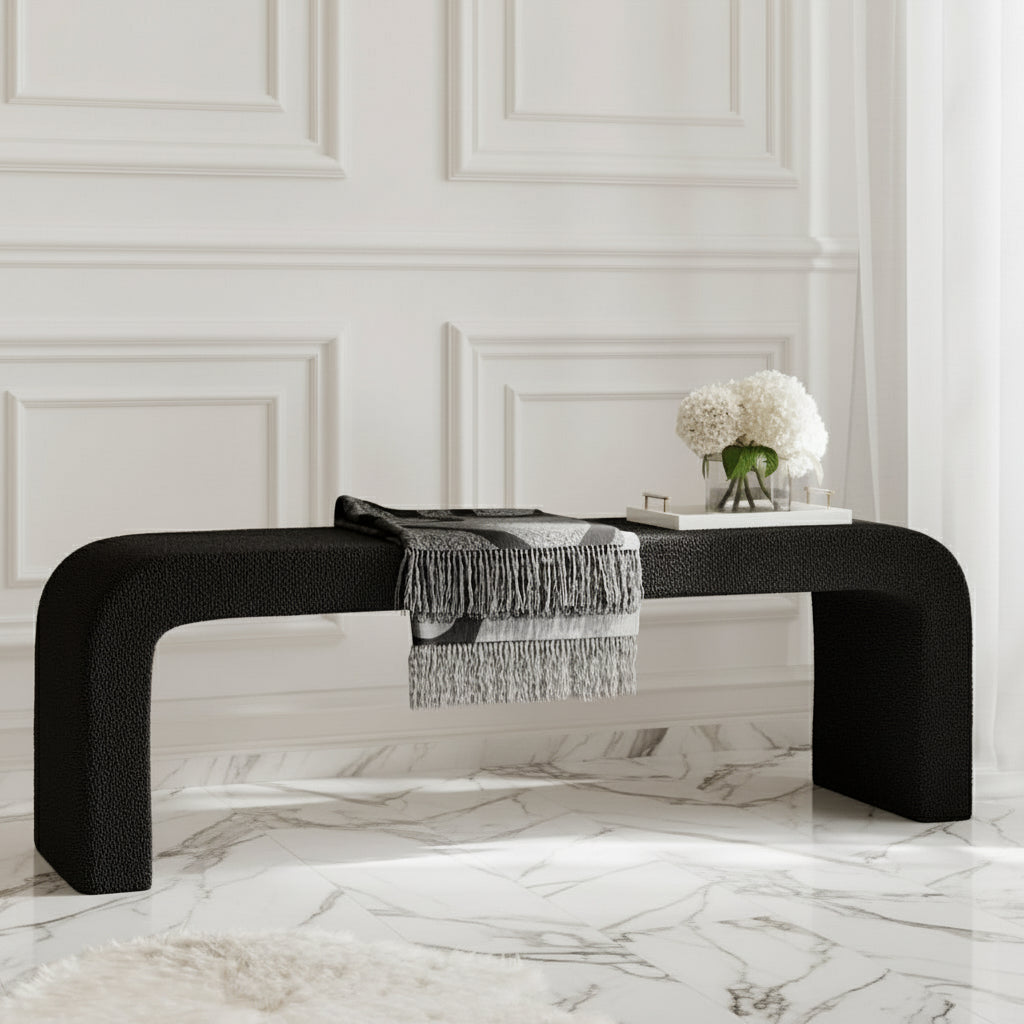 Black modern bench with a textured surface in a room with white paneled walls and marble flooring. Harry Christian Home Moderno Bench In Black. Harry Christian Home Benches. 