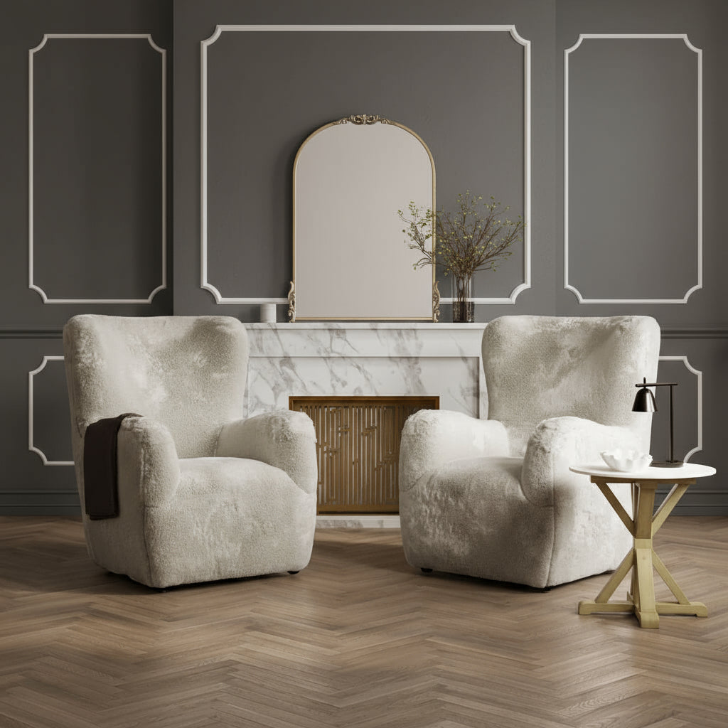 Two beige armchairs in a stylish living room with a mirror and small table.Harry Christian Home Stone & Latte Side Table