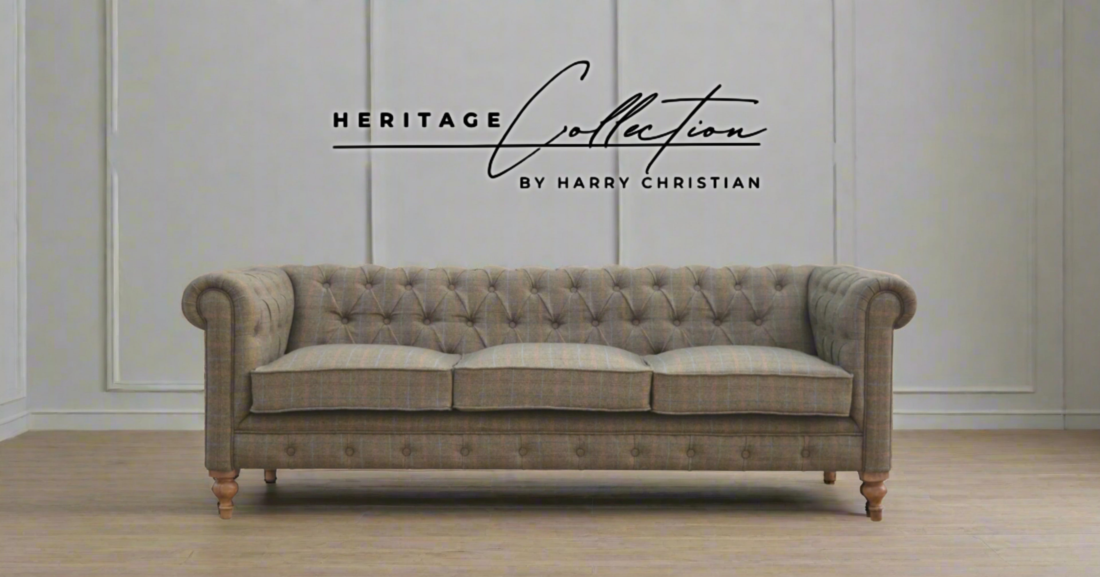 Vintage-style sofa with 'Heritage Collection by Harry Christian' text on a neutral background