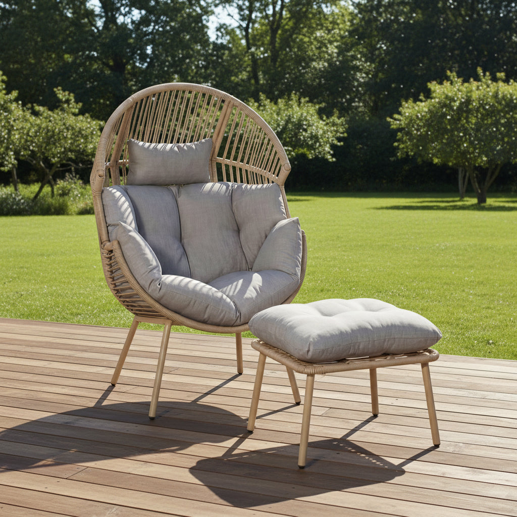 Wicker chair with gray cushions and matching ottoman on a white background